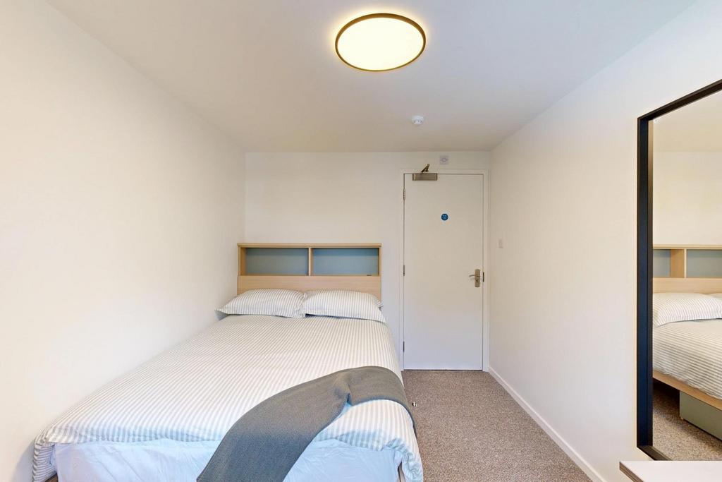 Bright, neatly presented bedroom with a double ...
