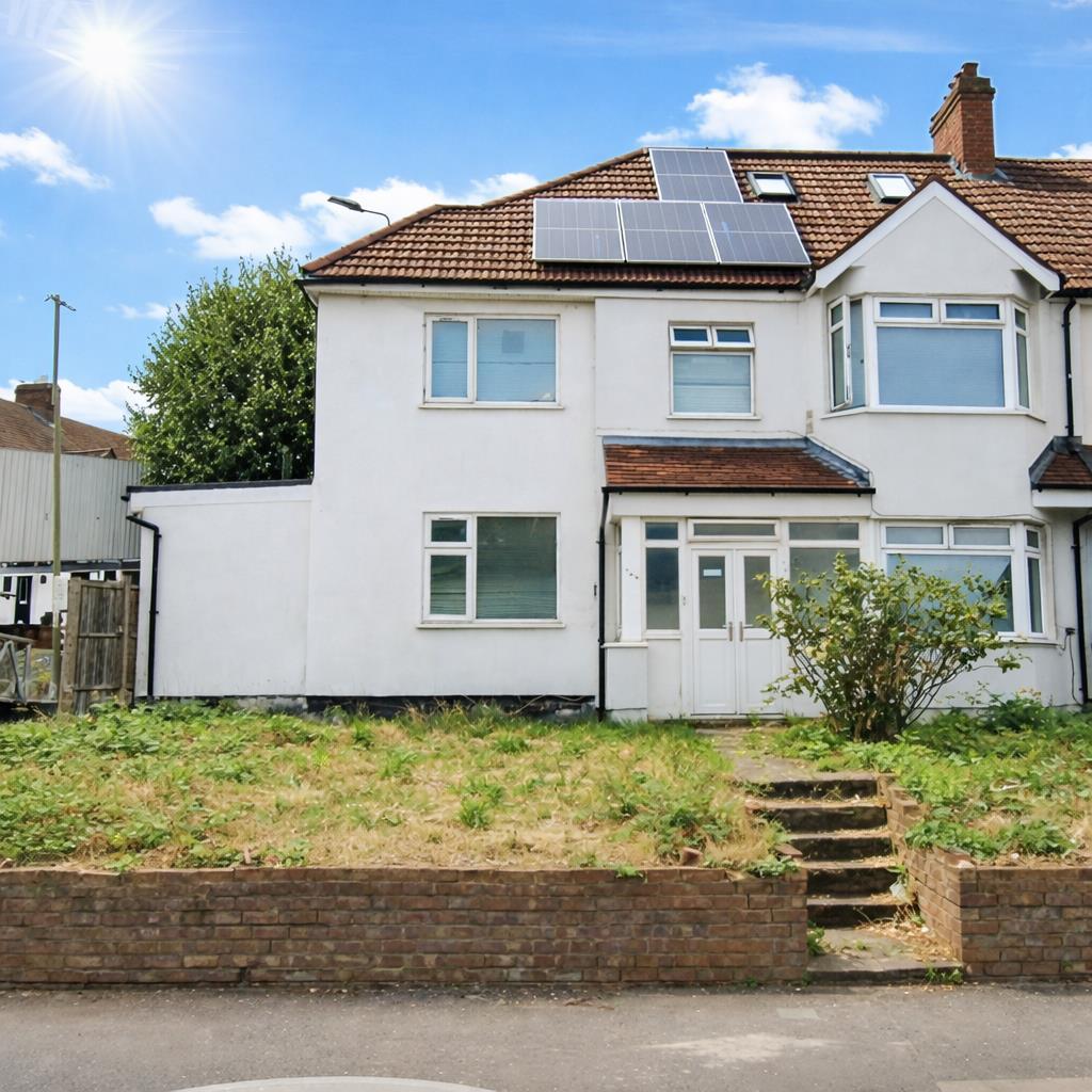 Suburban semi-detached home with solar panels.png
