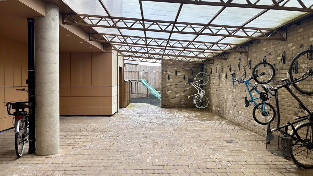 Covered communal bike storage area with secure ...