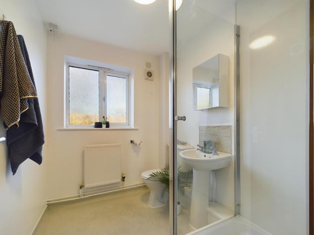 A clean and bright bathroom featuring a modern ...