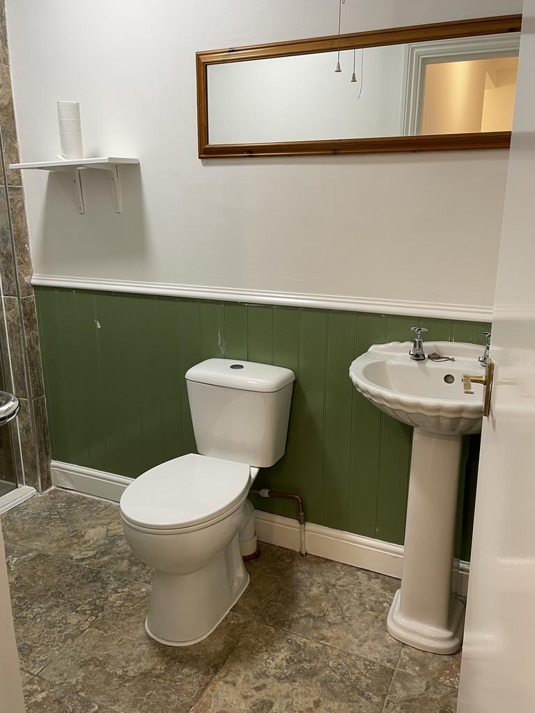 Neat, well-maintained bathroom with classic ped...