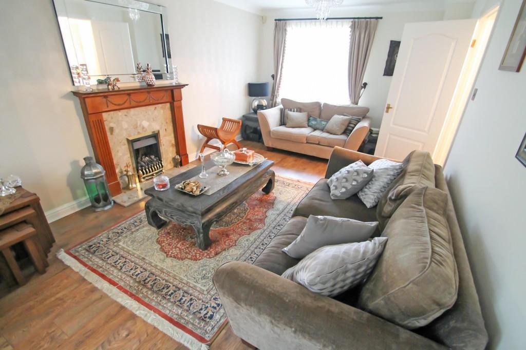 Well-appointed living room with plush sofas, a ...