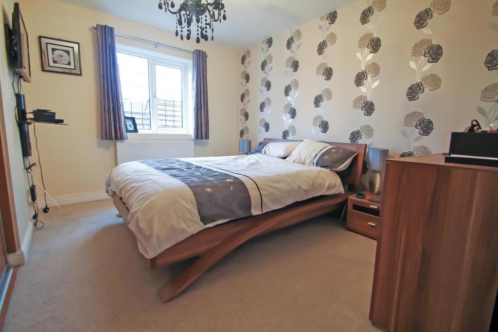 Bright, well-decorated bedroom with a stylish w...