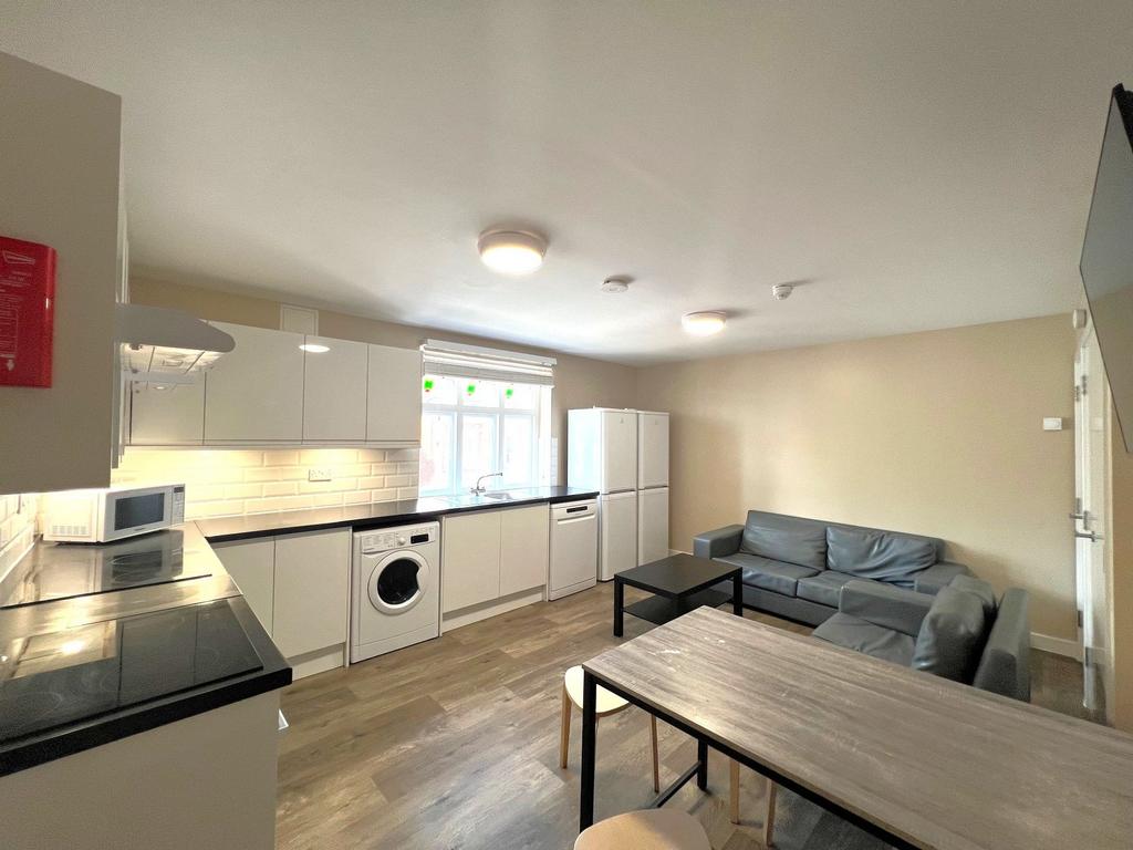 Bright, modern open-plan kitchen and living are...