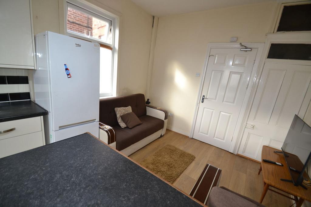 Bright, practical living area with a compact so...