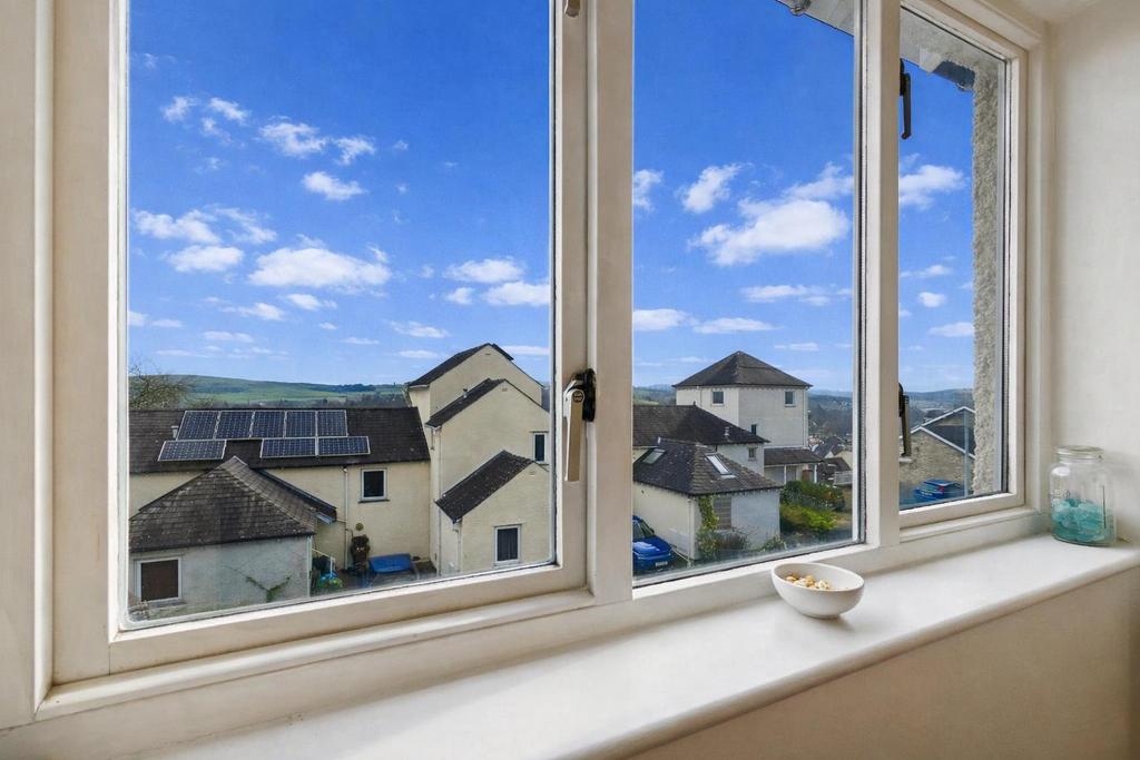 Bright view through a white-framed window.png