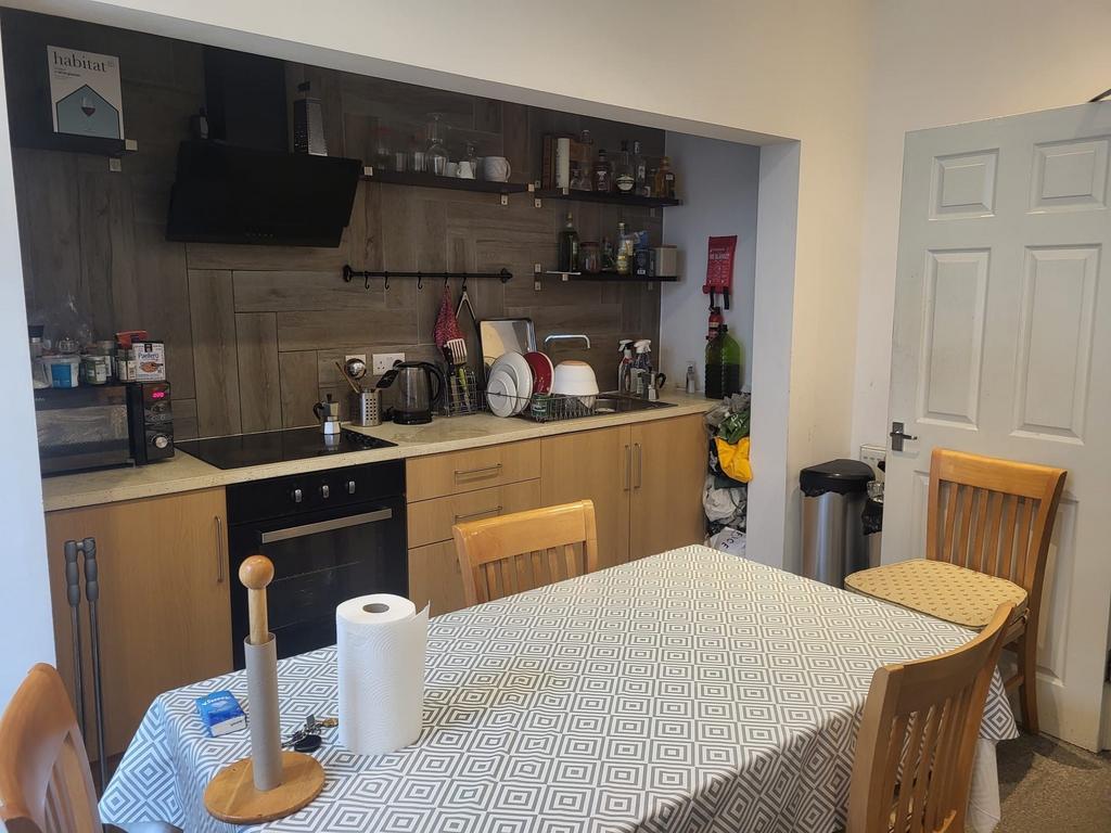 Well-equipped open kitchen with integrated oven...