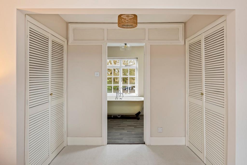 Principle bedroom with extensive wardrobe space