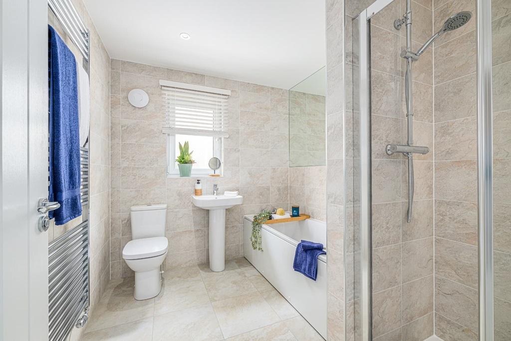 Family bathroom with shower and bath