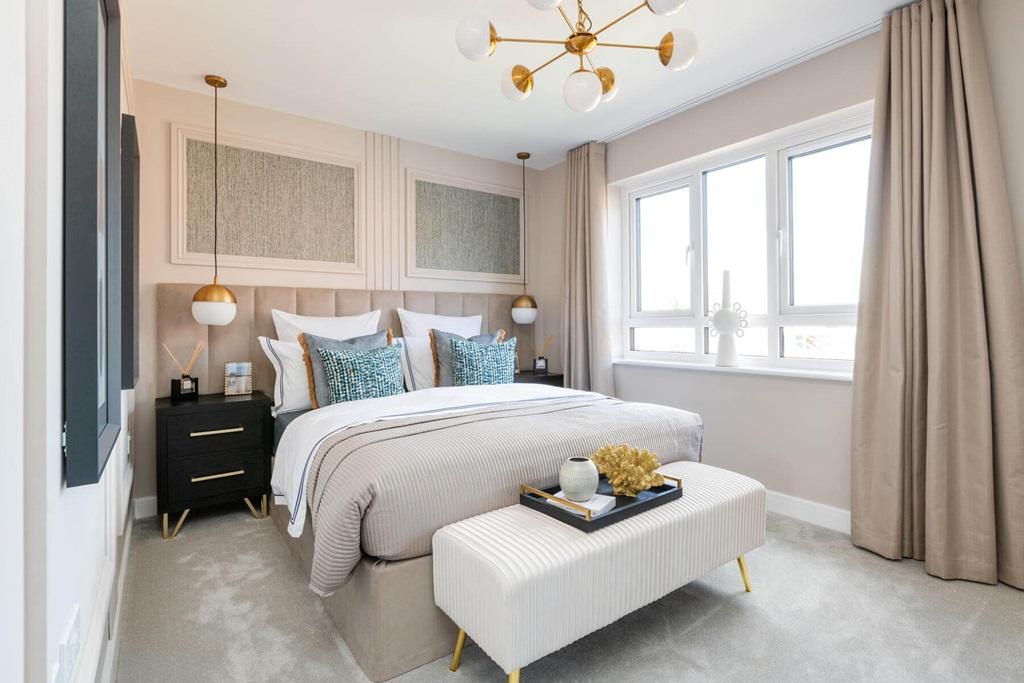 The spacious main bedroom creates space to...