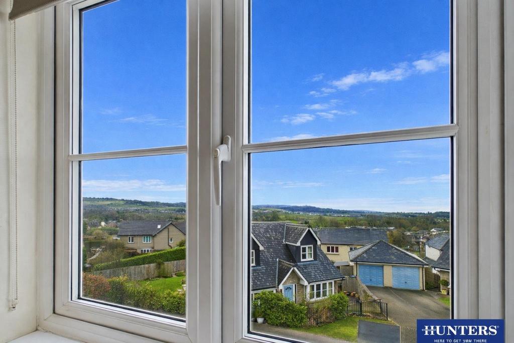 View of suburban neighbourhood through window.png