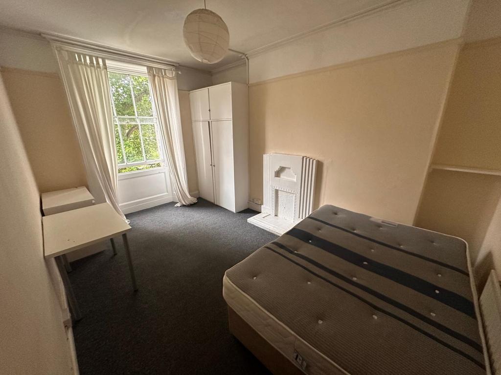Bright, well-proportioned bedroom with a large ...