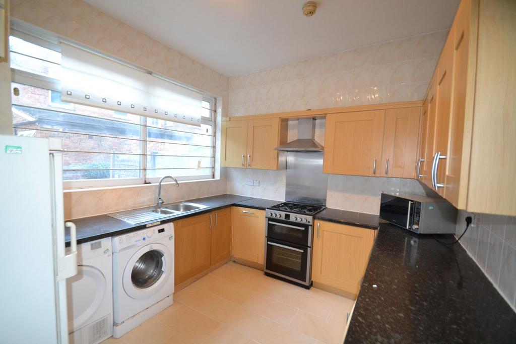 Bright and clean kitchen featuring ample natura...