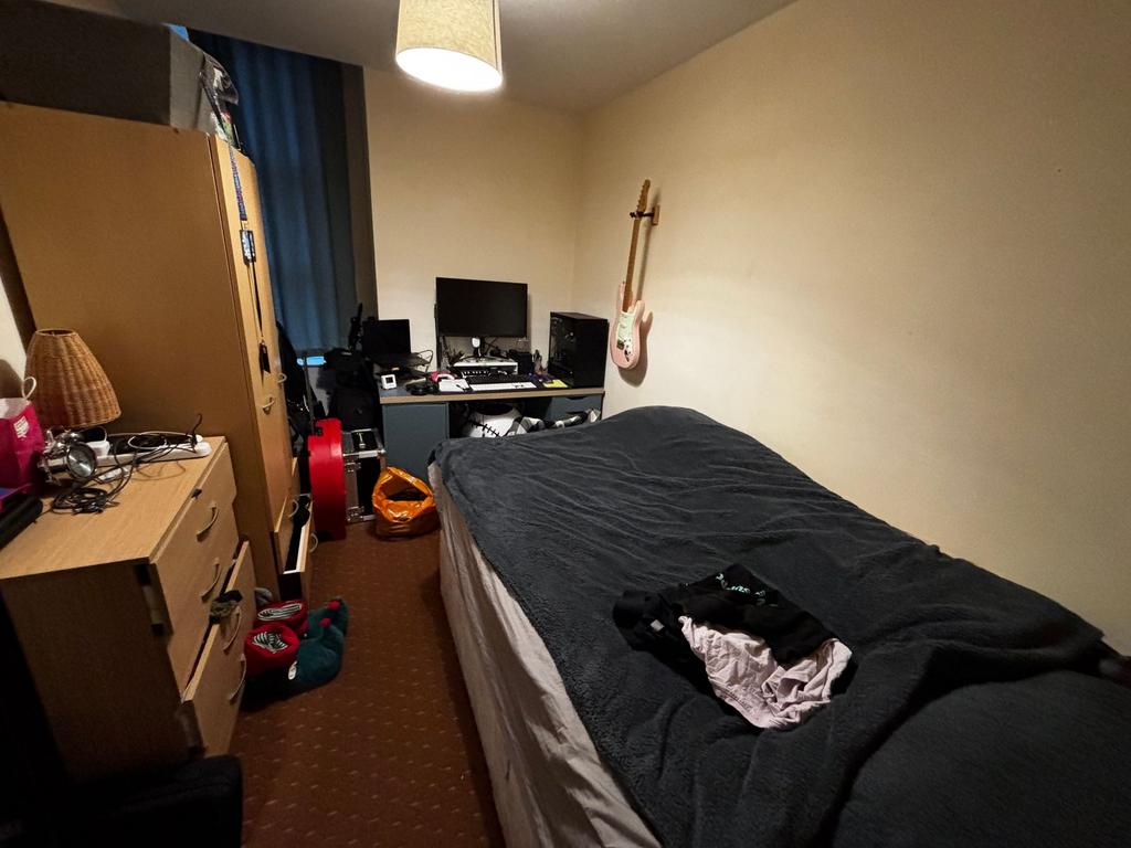 Cozy single bedroom with a comfortable bed, bed...