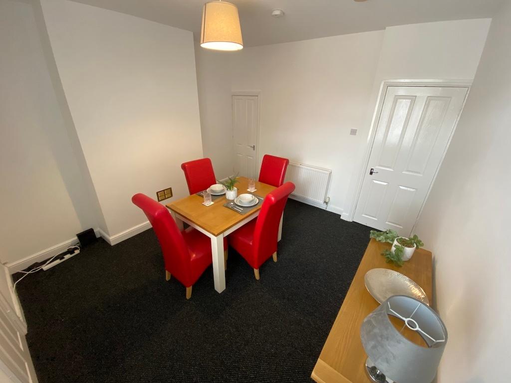 Bright, freshly painted dining/living room with...