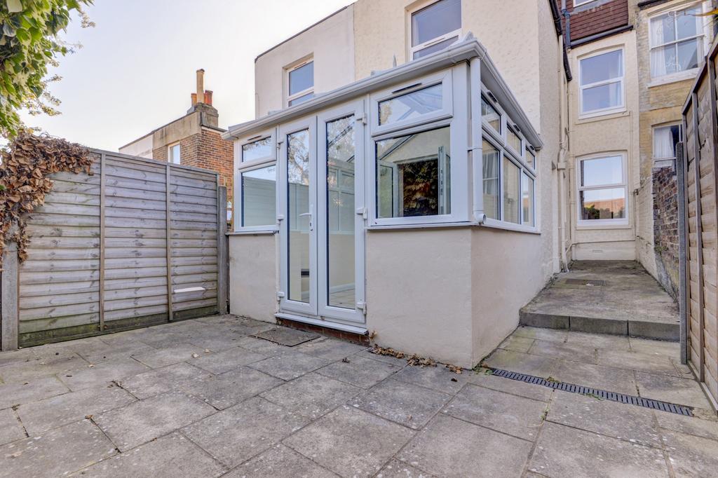 Paved private rear courtyard with direct access...