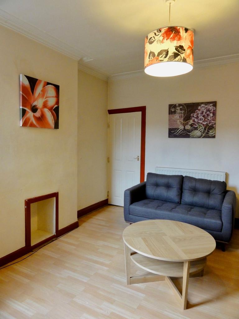 Bright and welcoming living room featuring a st...