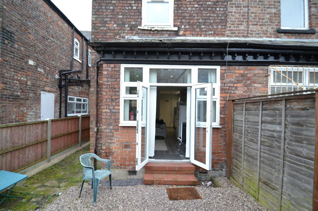 This charming garden area provides an inviting ...