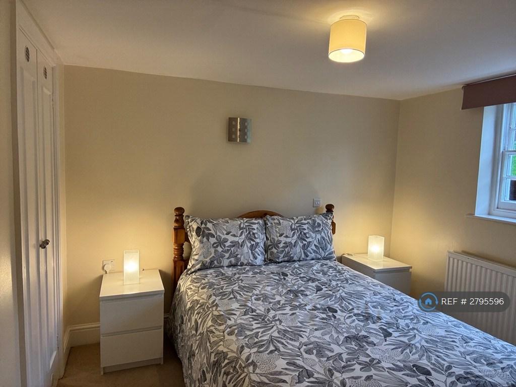 Bedroom With Wash Basin And Built In Wardrobe