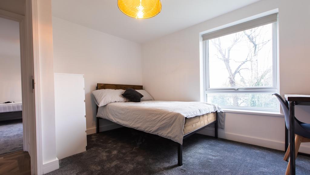 Bright, modern bedroom with a comfortable doubl...