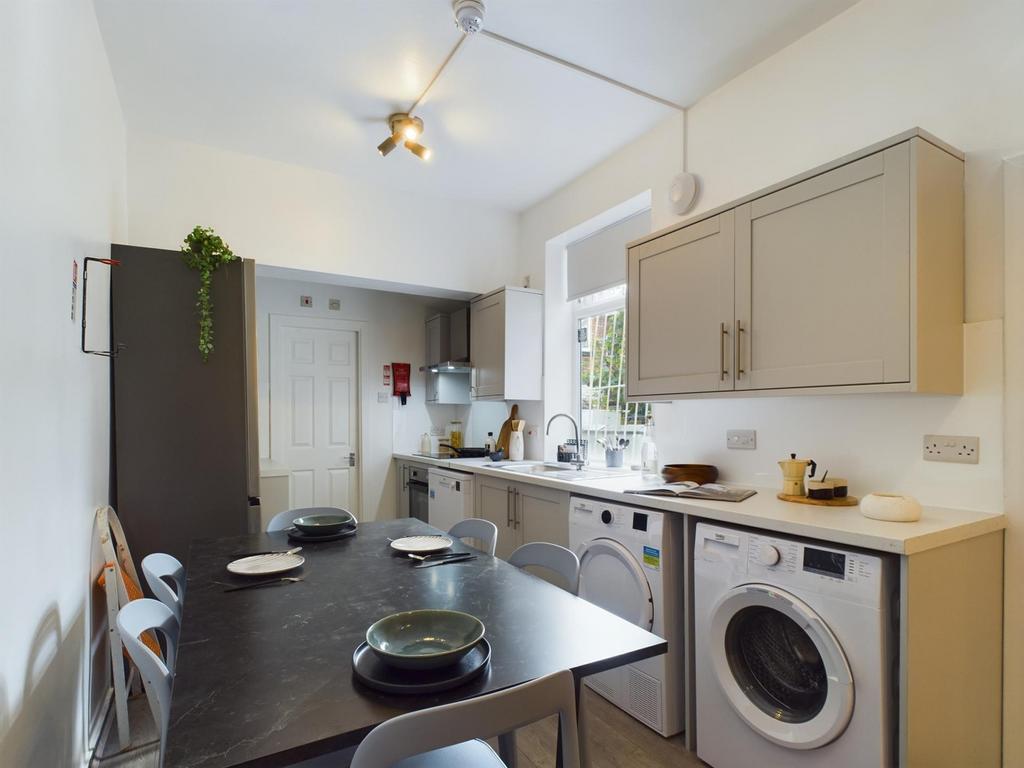 Spacious kitchen featuring modern appliances, a...