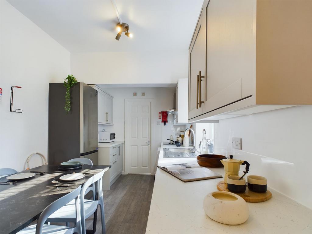 Bright and modern kitchen area featuring sleek ...