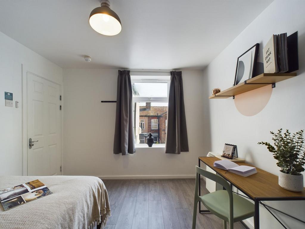 Bright and inviting double bedroom featuring a ...