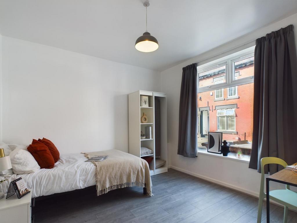 Bright and inviting double bedroom featuring am...