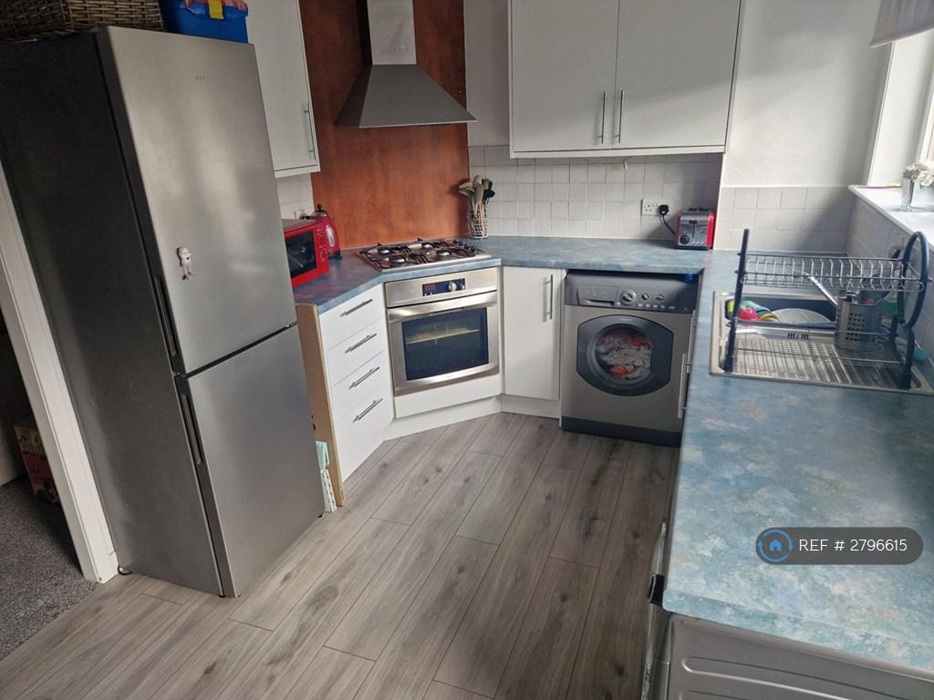 Kitchen With Dining Area Behind
