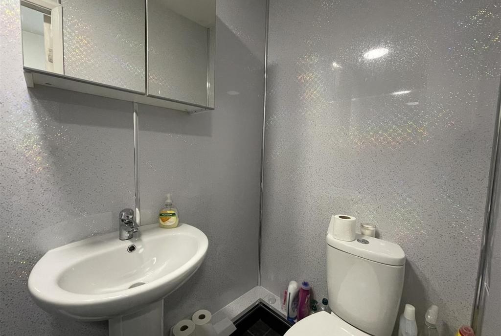 Bright, modern bathroom with a clean white basi...