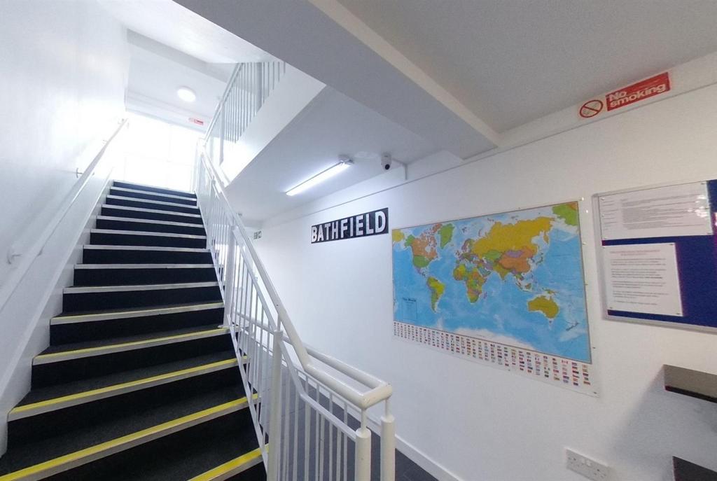 Bright, well-maintained internal staircase with...
