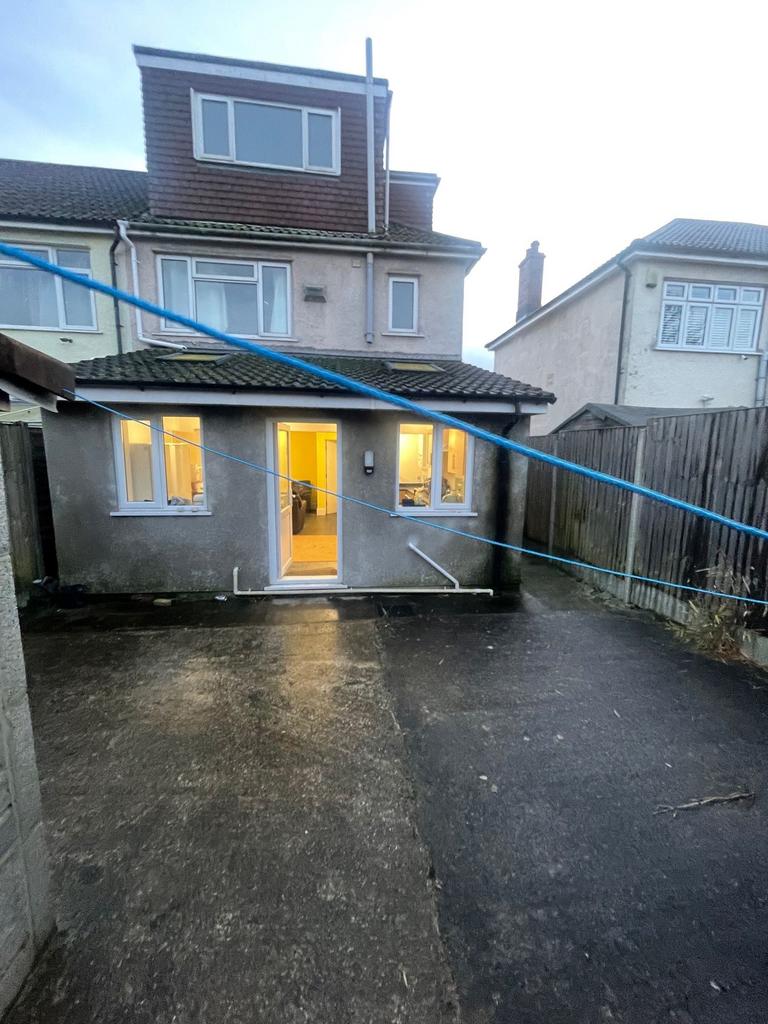 Private paved rear garden/yard with direct acce...