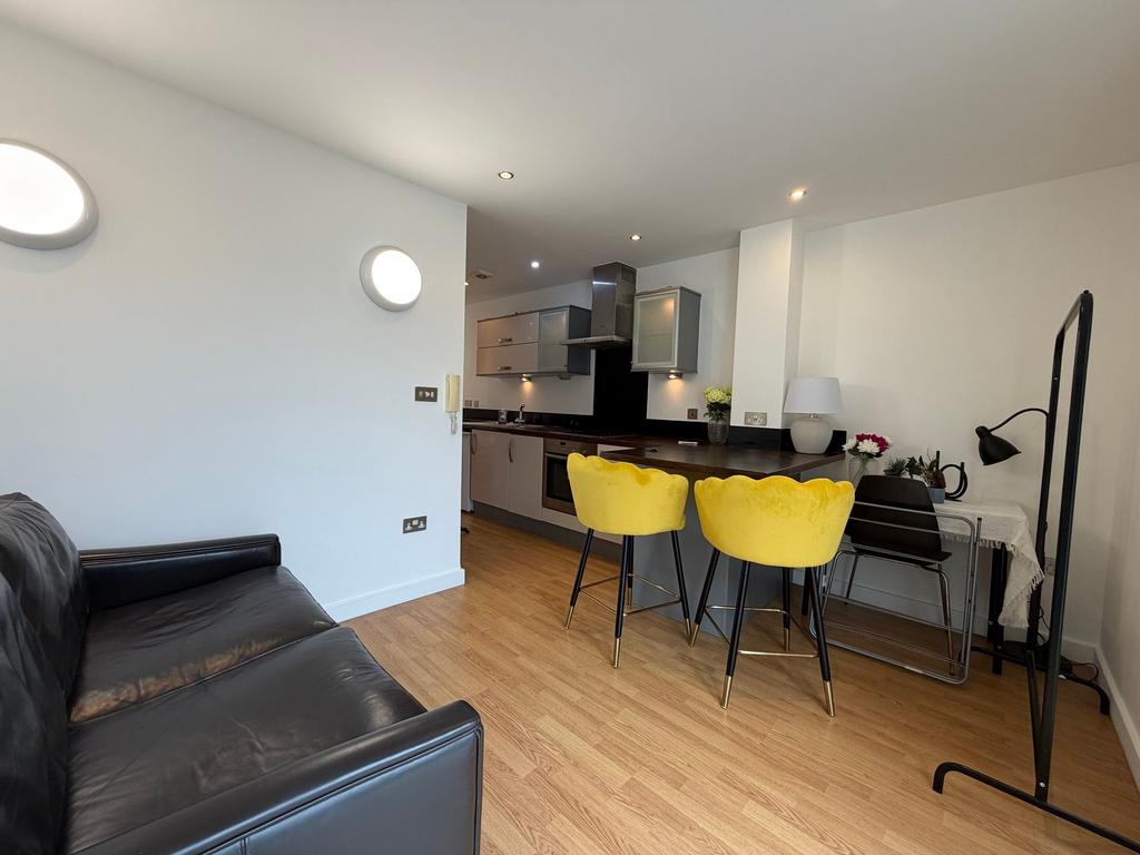 Contemporary open-plan living area with a sleek...
