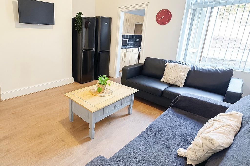 Bright, modern living room with two comfortable...