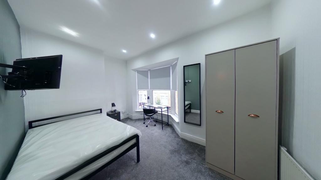 A bright and spacious double bedroom, perfect f...