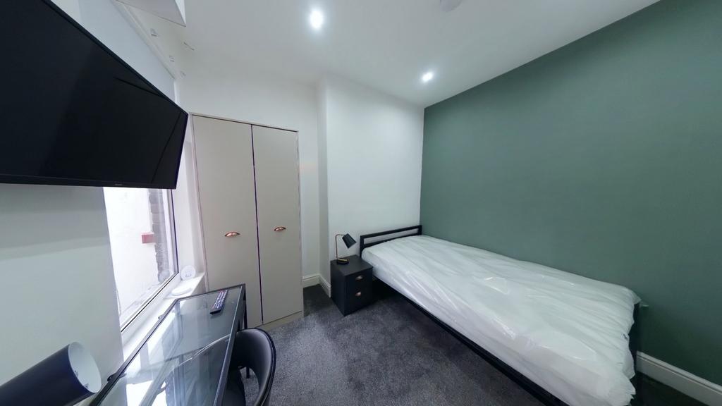 A bright and modern double bedroom featuring a ...