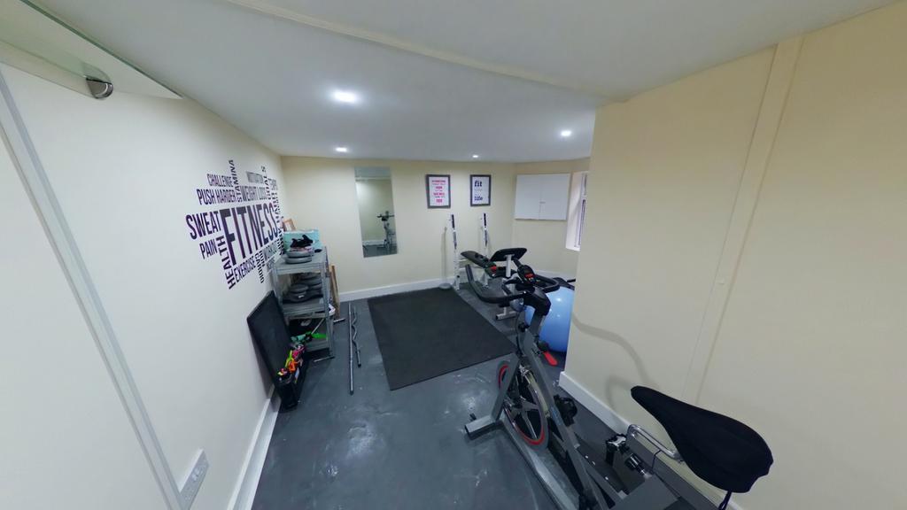 A bright and clean gym space equipped with exer...
