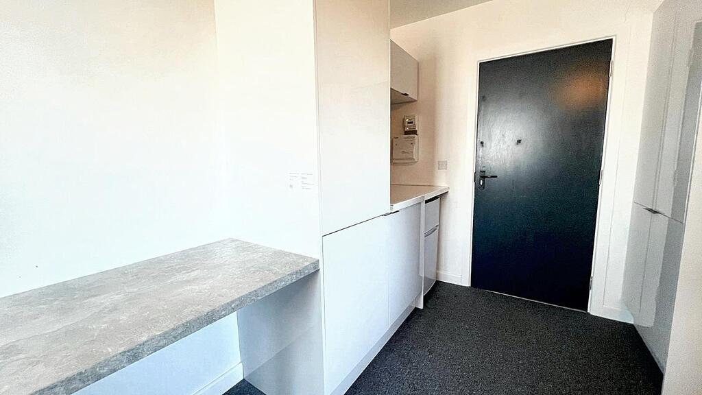 Bright, modern entrance hallway with a clean fi...