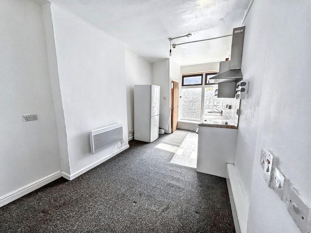 Bright kitchenette with fitted units, integrate...