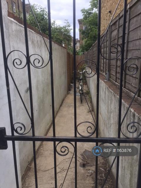 Outside Bike Storage Behind Locked Gate