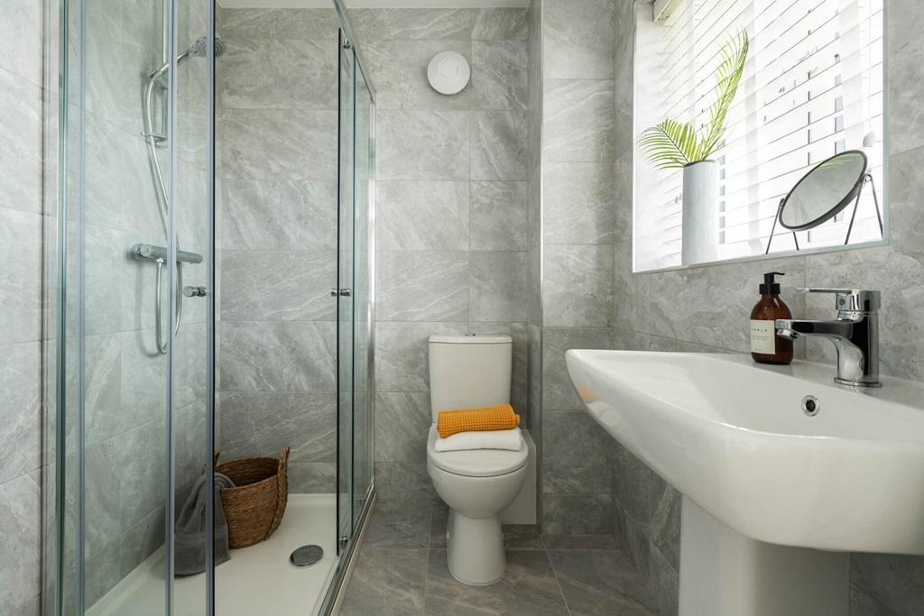 A peaceful en suite shower room designed for...