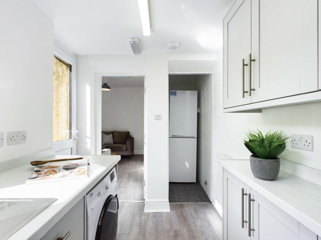 A bright and modern kitchenette featuring sleek...