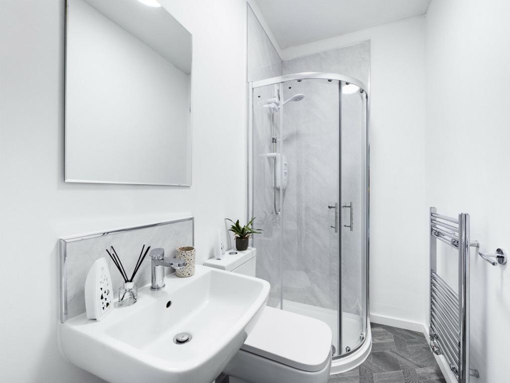 A modern and clean bathroom featuring a stylish...