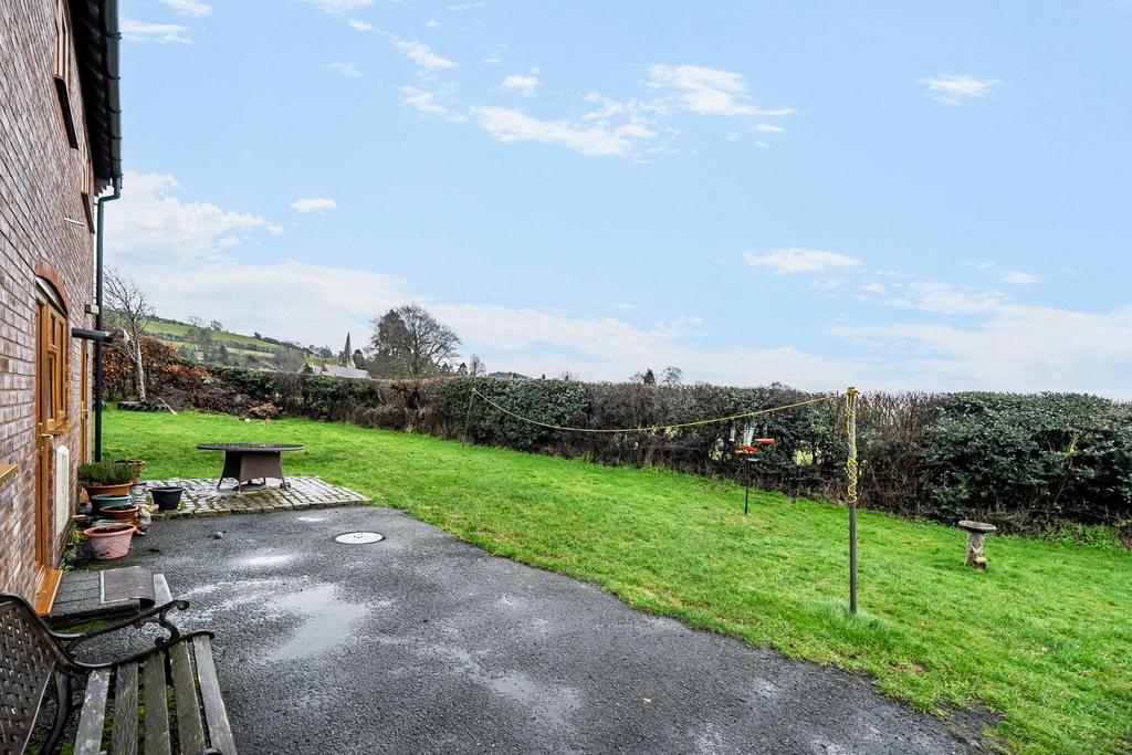 Rear tarmac and lawned area.jpg