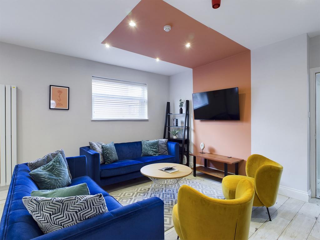 A spacious and stylish modern living room perfe...