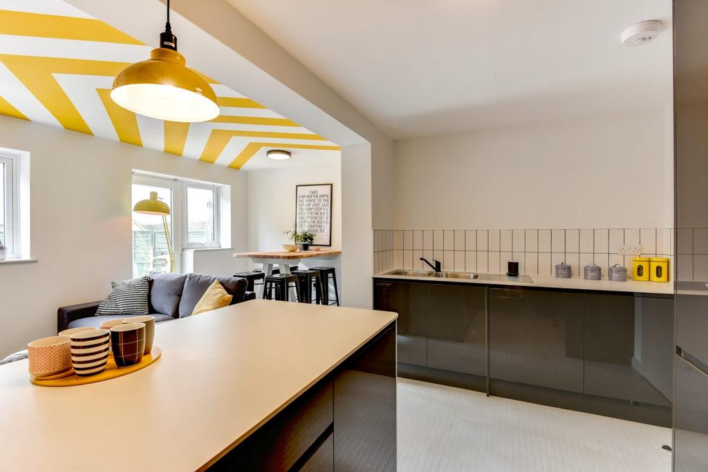 Bright open-plan living area with a modern kitc...