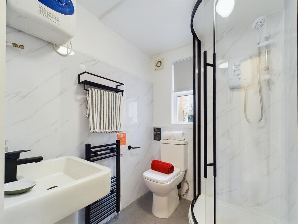 This modern bathroom features a sleek shower, c...
