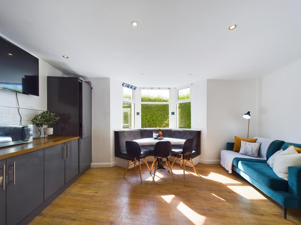 Bright and welcoming living room featuring larg...