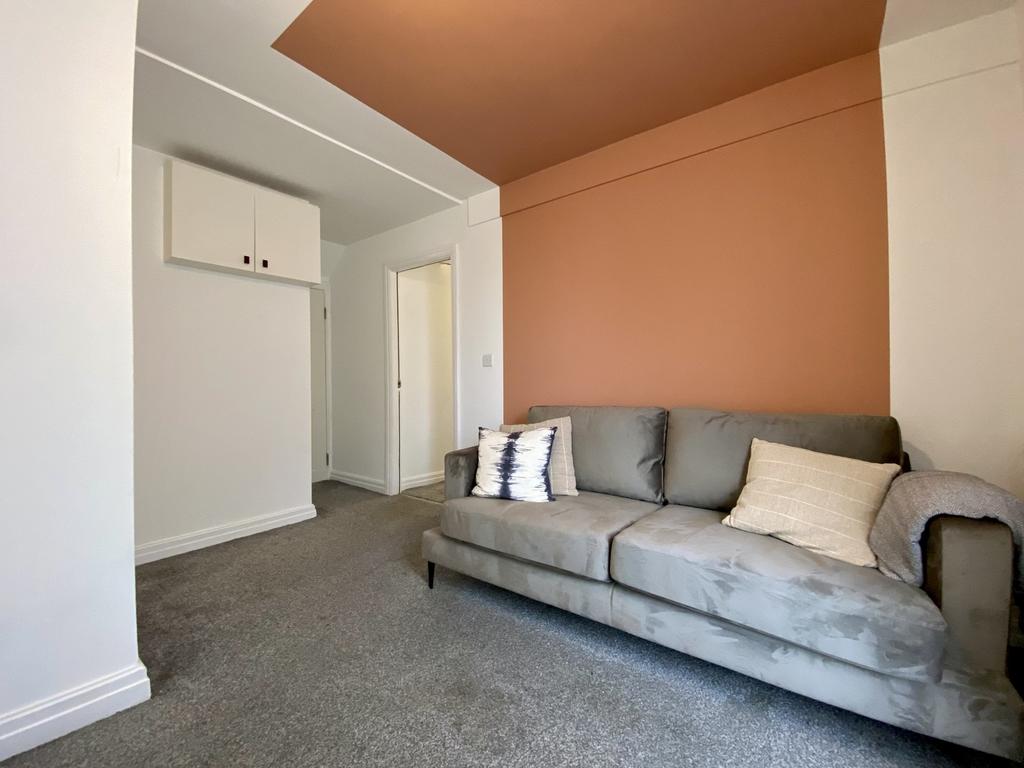 A cozy and inviting living room with a comforta...