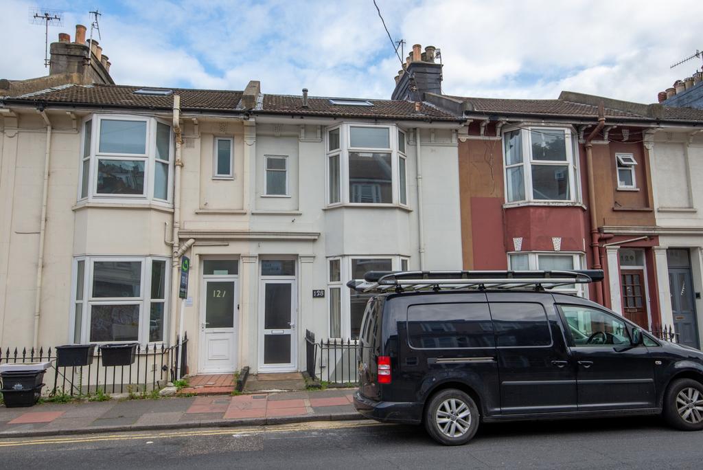 Terraced house with traditional bay windows and...